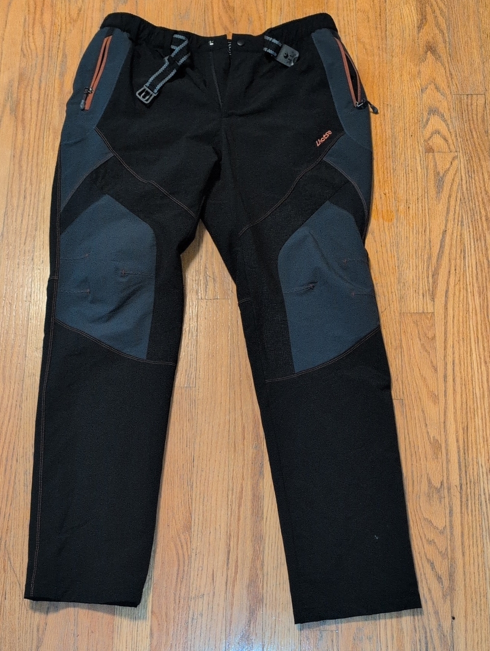 Men's Black Outdoor Pants with Dark Gray Panels and Orange Accents
